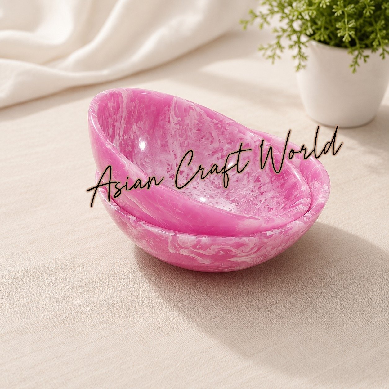 Set of four handcrafted resin bowls featuring vibrant pink and emerald green marbled swirl patterns by ACW