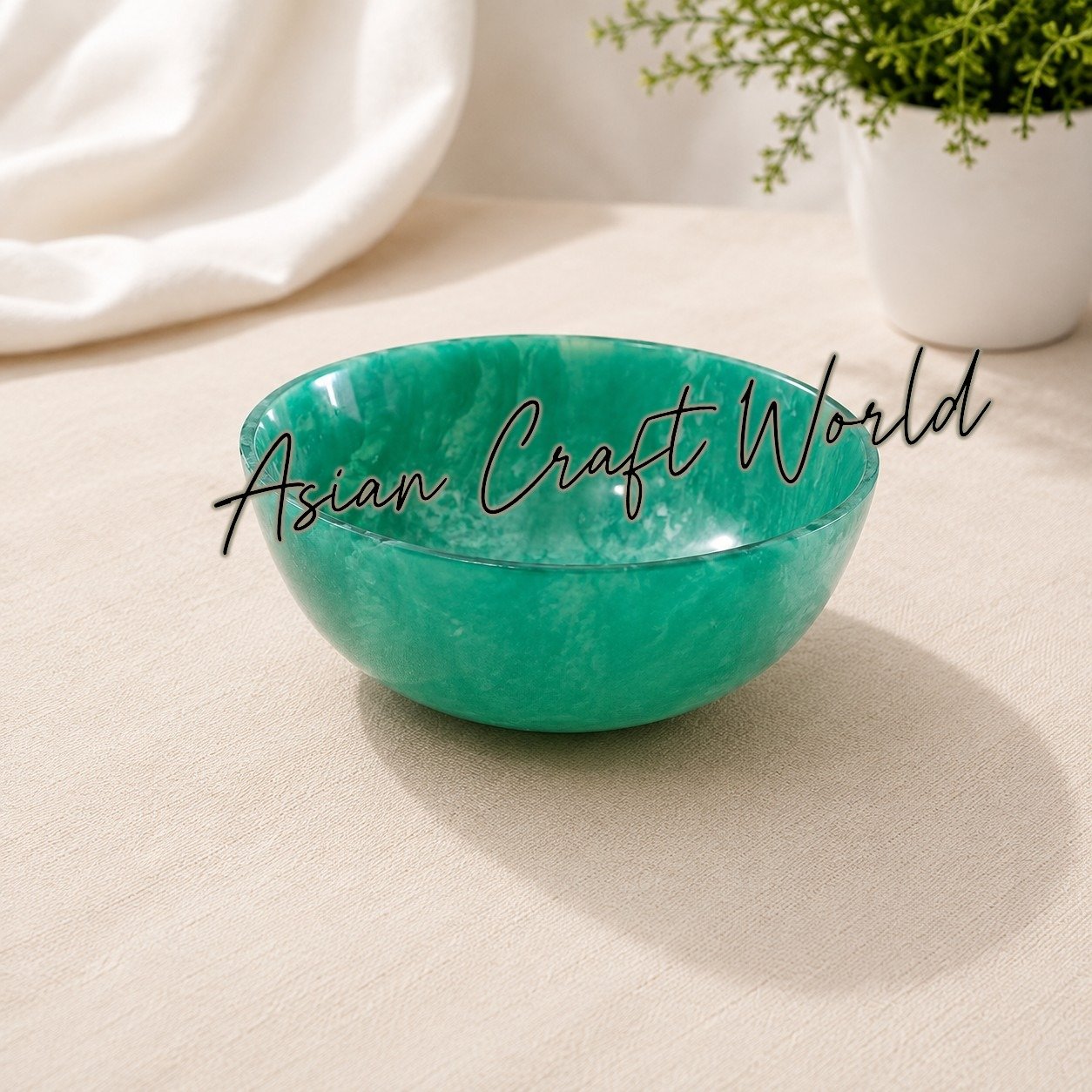 Vibrant pink and green handcrafted resin craft bowls crafted by artisans for versatile kitchen and living space decor.